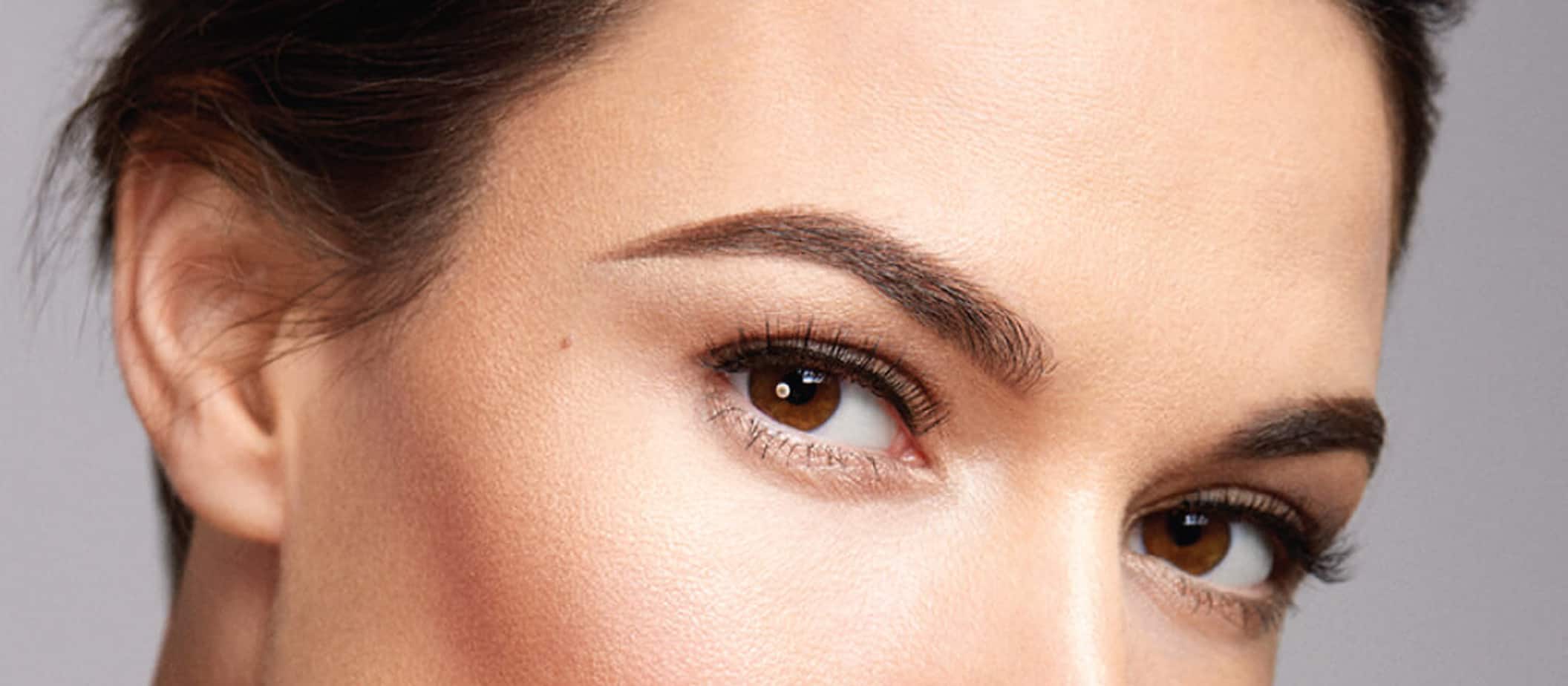woman's face with beautifully tinted & shaped brows
